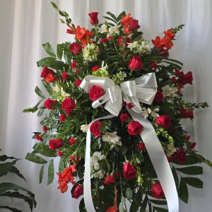 Funeral pedestal of red roses